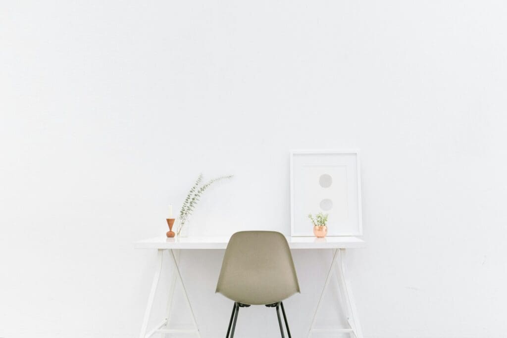 white wooden table near brown chair