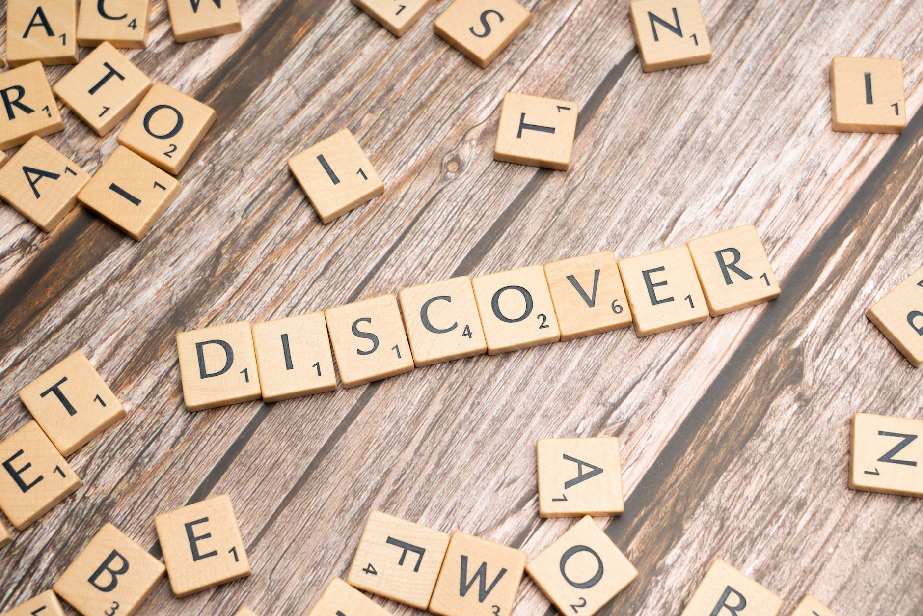 the word discover spelled out in scrabble letters